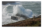 Storm waves hitting harbour wall